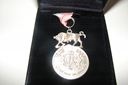Product Description: A.D. Club Sterling Silver Medal with pink and white ribbon.</br> Club Medal
